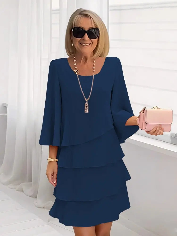 Andrea – Vestido elegante con volantes